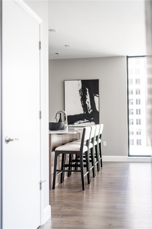 dining room with hardwood / wood-style flooring