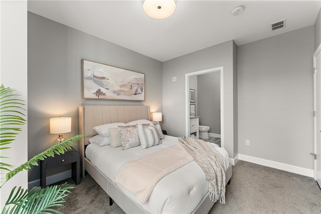 carpeted bedroom with ensuite bath