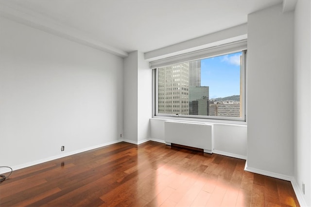 empty room featuring hardwood / wood-style flooring