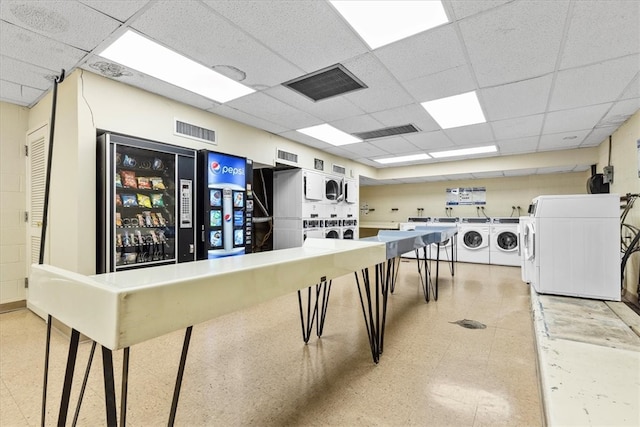 interior space featuring stacked washer and dryer, tile floors, and washing machine and dryer