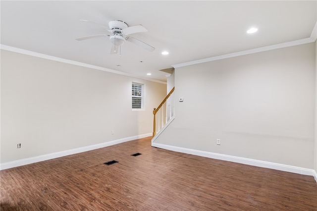 unfurnished room with ceiling fan, ornamental molding, and dark wood-type flooring