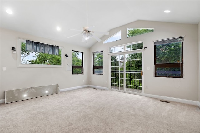 spare room with carpet, ceiling fan, and vaulted ceiling