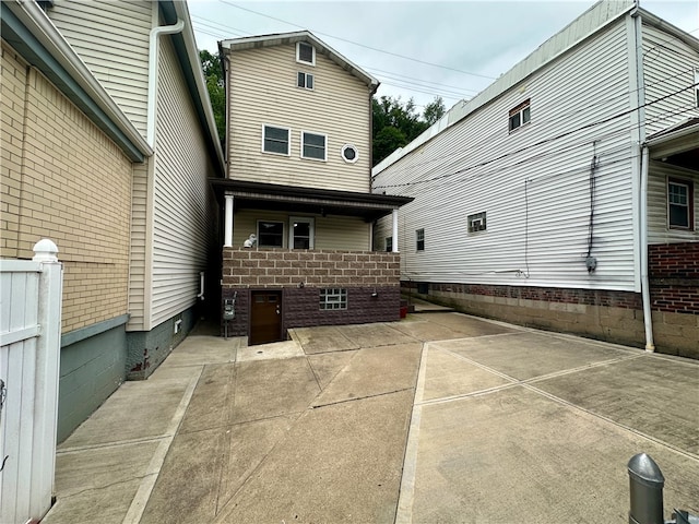 back of house with a patio area