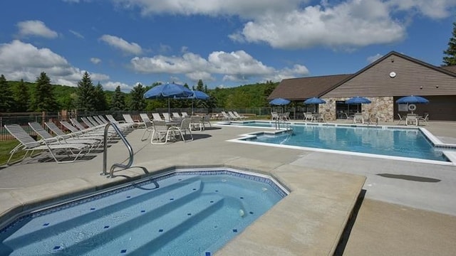 view of swimming pool featuring a patio