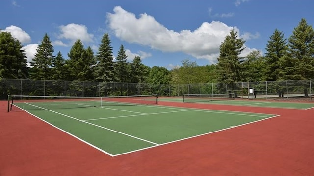 view of sport court with basketball hoop