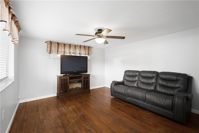 unfurnished living room with ceiling fan and dark hardwood / wood-style floors