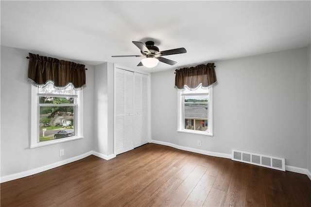 unfurnished room featuring ceiling fan and hardwood / wood-style floors