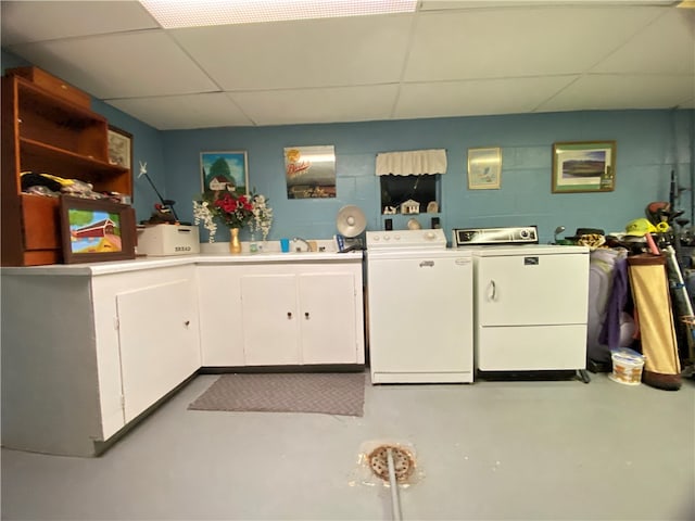 laundry area with cabinets and washing machine and dryer