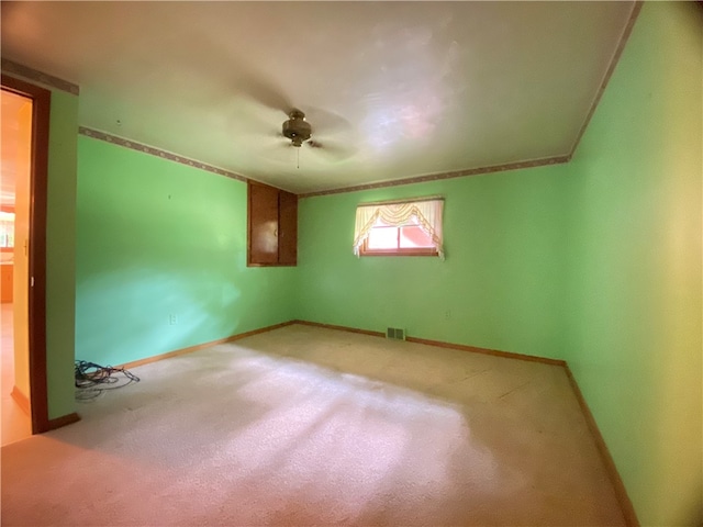 unfurnished room with carpet floors and ceiling fan