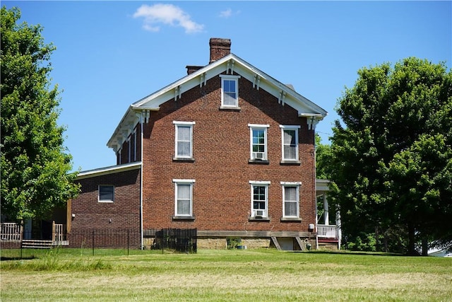 view of home's exterior with a lawn