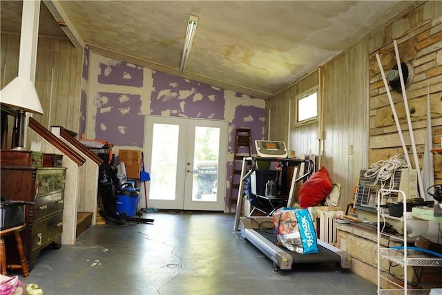 misc room featuring wooden walls and french doors