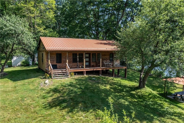 470 Truitt Rd, Pa, PA 16374 - view of front of property featuring a porch, a front yard, metal roof, and a standing seam roof