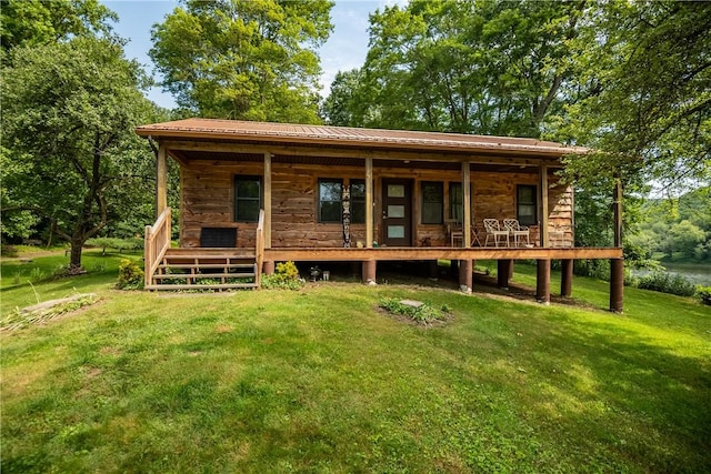 470 Truitt Rd, Pa, PA 16374 - view of front of home featuring covered porch, a front yard, metal roof, and stone siding