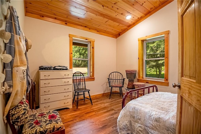 470 Truitt Rd, Pa, PA 16374 - bedroom with vaulted ceiling, wood ceiling, multiple windows, wood finished floors, and baseboards