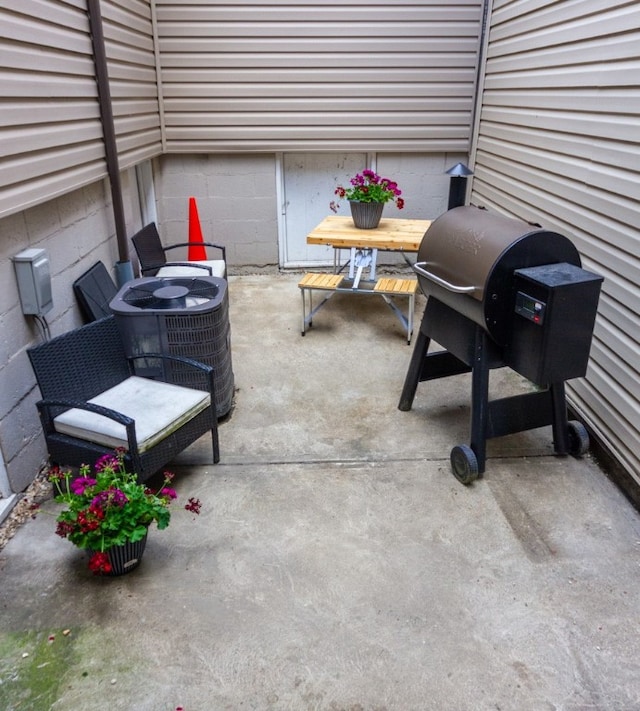 view of patio featuring grilling area and central air condition unit