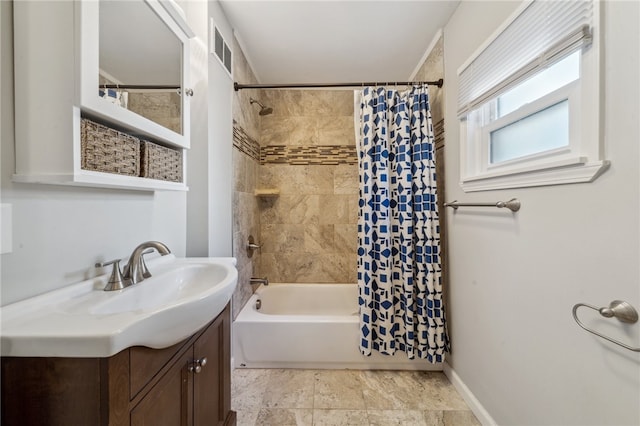 bathroom with shower / tub combo with curtain and vanity