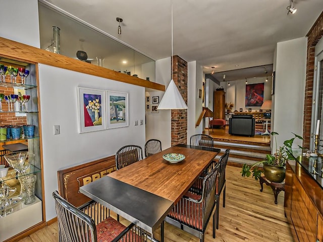 dining space featuring wood finished floors