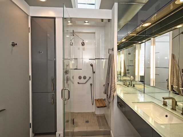 bathroom with an enclosed shower and vanity