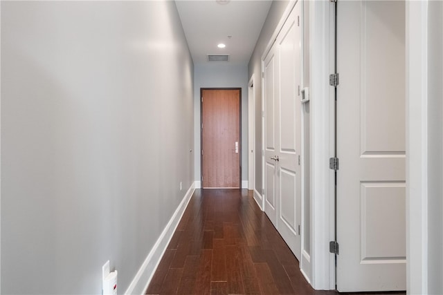 corridor featuring wood-type flooring