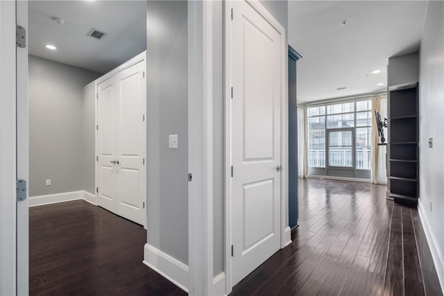 hallway with dark wood-type flooring