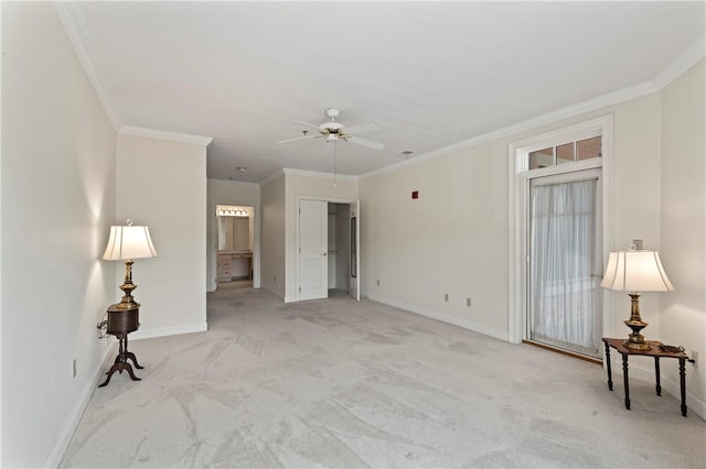 carpeted empty room with ornamental molding and ceiling fan