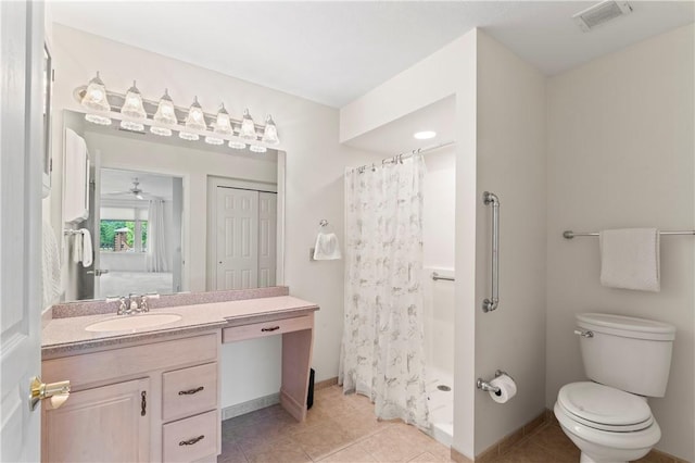 bathroom with tile patterned flooring, vanity, toilet, and a shower with shower curtain