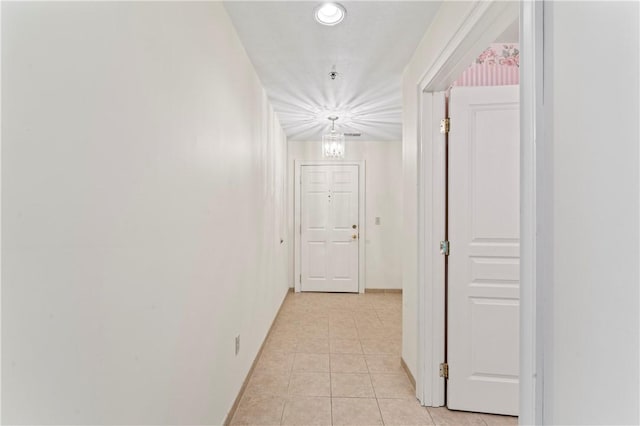 hallway featuring light tile patterned flooring