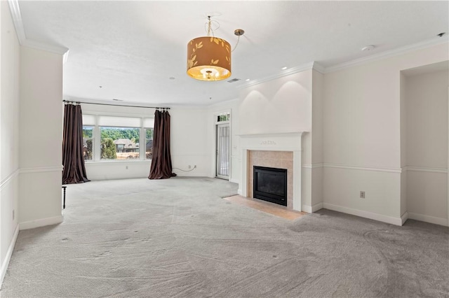 unfurnished living room featuring light colored carpet, ornamental molding, and a fireplace