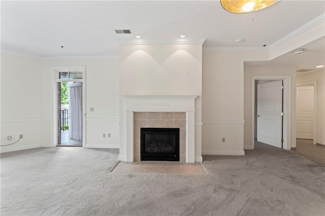 unfurnished living room featuring crown molding, light carpet, and a fireplace