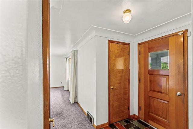 view of carpeted foyer