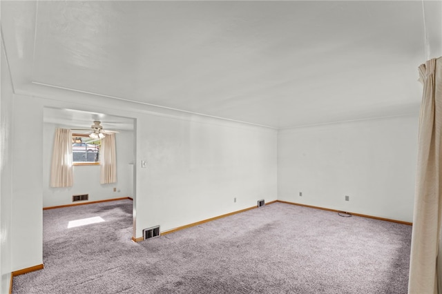 unfurnished room featuring ceiling fan and carpet floors