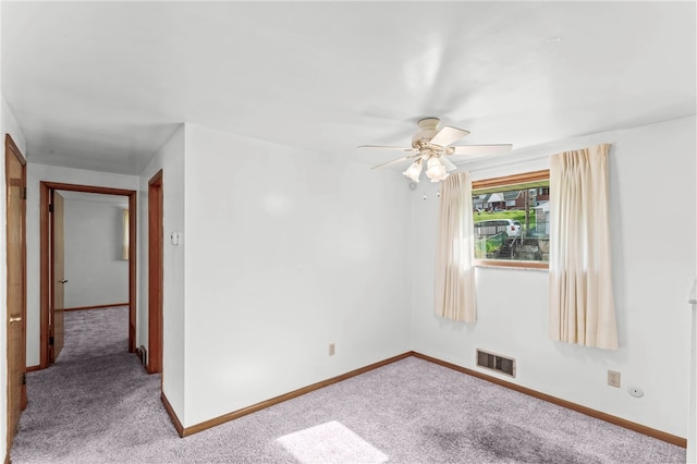 unfurnished room featuring carpet and ceiling fan