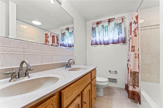 full bathroom with tile flooring, toilet, shower / bath combo with shower curtain, and double sink vanity