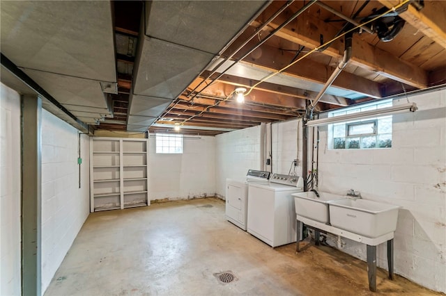 basement featuring sink and washing machine and dryer