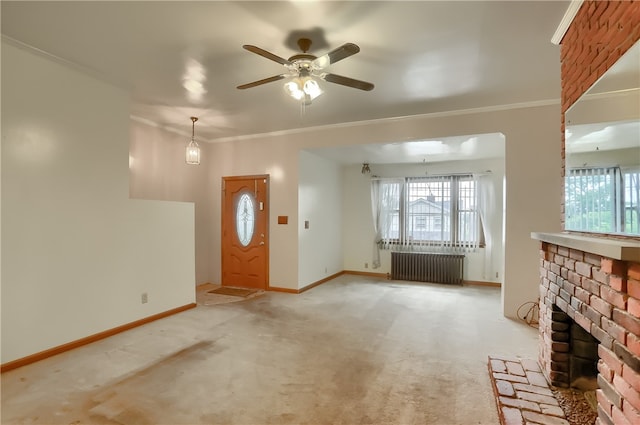 unfurnished living room featuring light carpet, radiator heating unit, ceiling fan, a fireplace, and crown molding