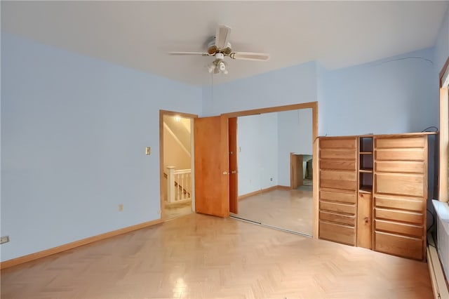 unfurnished bedroom featuring light parquet floors, a closet, and ceiling fan