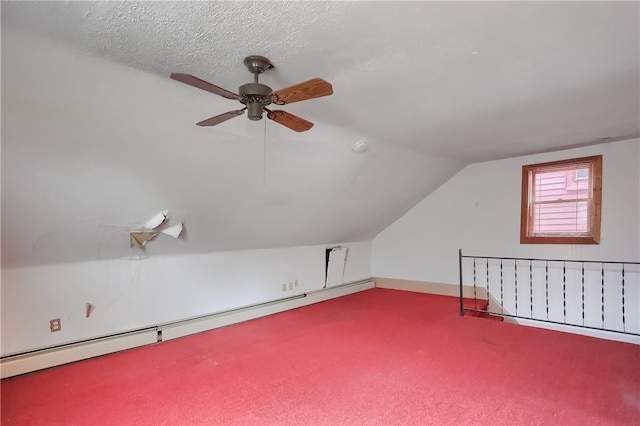 bonus room featuring carpet flooring, a textured ceiling, ceiling fan, lofted ceiling, and baseboard heating