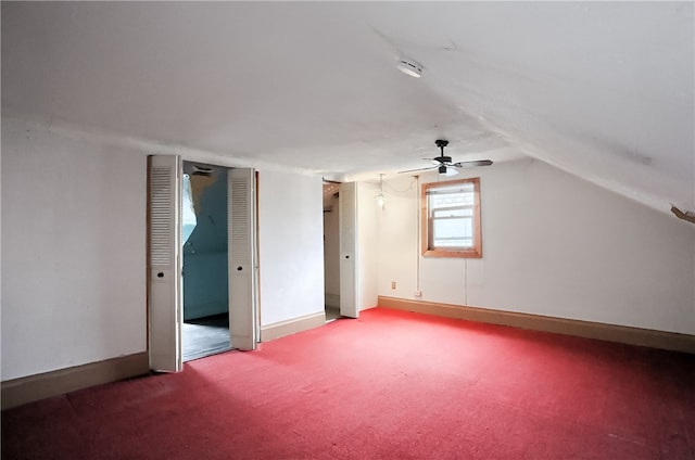 bonus room with lofted ceiling, carpet, and ceiling fan