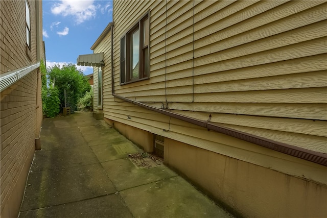 view of side of home featuring a patio area