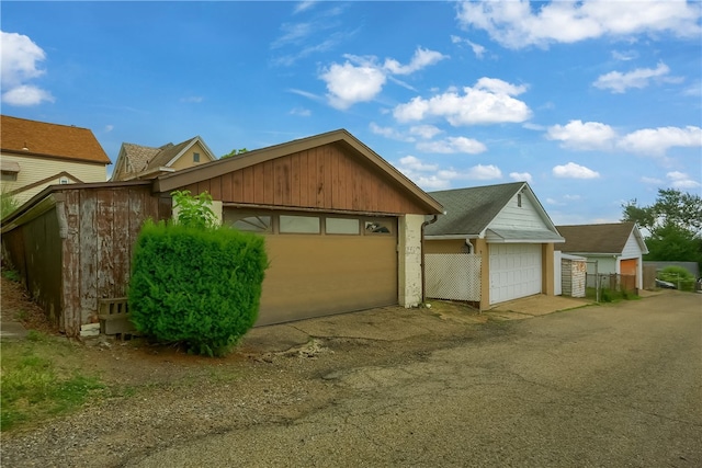 ranch-style home with an outbuilding