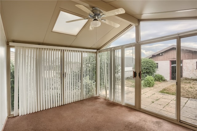 unfurnished sunroom with vaulted ceiling with beams and ceiling fan