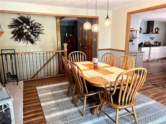 dining area with hardwood / wood-style floors