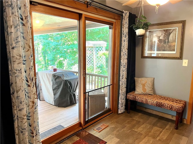 entryway with hardwood / wood-style floors