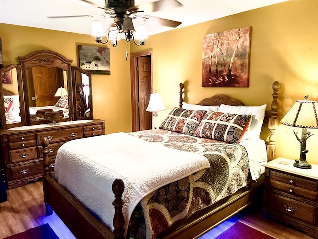 bedroom featuring dark hardwood / wood-style floors and ceiling fan