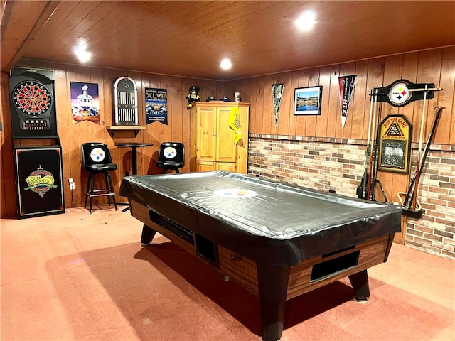 rec room featuring pool table, light carpet, and wooden walls