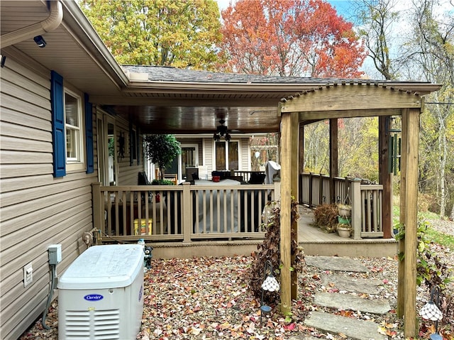 wooden deck with ceiling fan and a porch