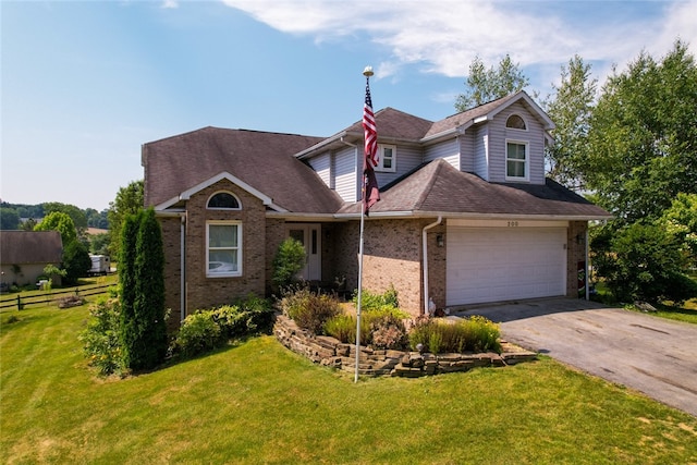 front facade featuring a garage and a front lawn