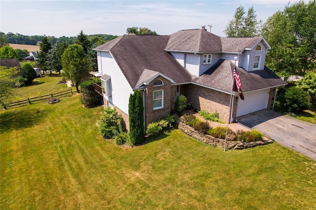 view of front facade with a garage and a front lawn