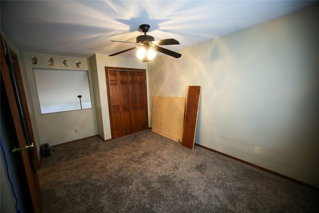 unfurnished bedroom with carpet, a closet, and ceiling fan