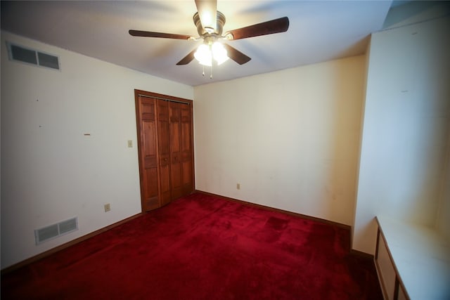 spare room featuring carpet and ceiling fan